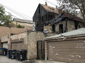 This shows the tattered home Wednesday, Aug. 29, 2018, after a deadly fire early Sunday. (Ashlee Rezin /Chicago Sun-Times via AP)