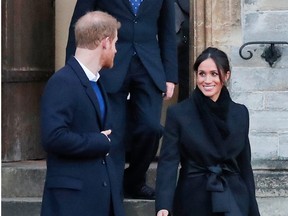 Britain's Prince Harry and his fiancee Meghan Markle leave after a visit to Cardiff Castle in Cardiff, Wales, on Thursday, Jan. 18, 2018.