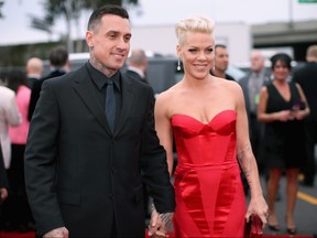 Off-road truck racer Carey Hart and singer Pink attend the 56th GRAMMY Awards at Staples Center on January 26, 2014 in Los Angeles, California.