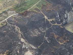 This undated photo released by the Irish Air Corps on Aug. 4, 2018, shows the word Eire, which means Ireland on Bray Head, Ireland. (Garda Air Support Unit/Irish Air Corps via AP)