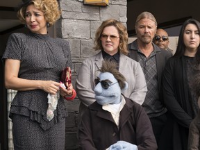 This image released by STX Entertainment shows Maya Rudolph, left, and Melissa McCarthy, background centre in a scene from "The Happytime Murders." (Hopper Stone/STX Entertainment via AP)