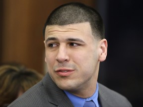 Former New England Patriots tight end Aaron Hernandez reacts to his double murder acquittal after the sixth day of jury deliberations at Suffolk Superior Court in Boston on April 14, 2017.
