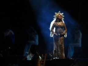 (FILES) In this file photo taken on February 12, 2017 Beyonce performs as she is pregnant with twins during the 59th Annual Grammy music Awards in Los Angeles, California.  August 6, 2018, Beyonce has called for a greater acceptance of naturally curvy figures, saying she was listening more to her body after giving birth to twins by Caesarean section last year.