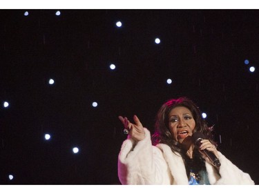 In this file photo taken on December 6, 2013 Singer Aretha Franklin performs during the National Christmas Tree Lighting ceremony on the Ellipse adjacent to the White House in Washington, DC. -