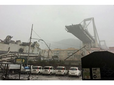 This handout picture provided by the Italian police (Polizia di Stato) on Aug. 14, 2018 shows a collapsed section of a viaduct on the A10 motorway in Genoa.