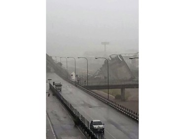 This handout picture provided by the Italian police (Polizia di Stato) on Aug. 14, 2018 shows a collapsed section of a viaduct on the A10 motorway in Genoa.