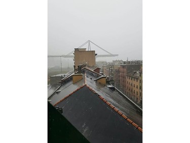 This handout picture provided by the Italian police (Polizia di Stato) on Aug. 14, 2018 shows a collapsed section of a viaduct on the A10 motorway in Genoa.