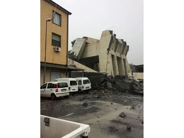 This handout picture provided by the Italian police (Polizia di Stato) on Aug. 14, 2018 shows a collapsed section of a viaduct on the A10 motorway in Genoa.