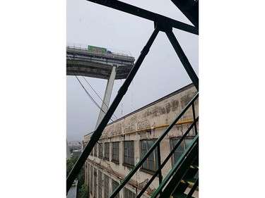 This handout picture provided by the Italian police (Polizia di Stato) on Aug. 14, 2018 shows a truck trapped on a viaduct after it collapsed on the A10 motorway in Genoa.