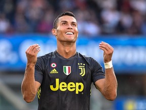 Juventus' Portuguese forward Cristiano Ronaldo reacts after missing a shot during the Italian Serie A football match AC Chievo vs Juventus at the Marcantonio-Bentegodi stadium in Verona on August 18, 2018.