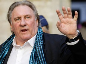 In this file photo taken on June 25, 2018, French actor Gerard Depardieu waves as he arrives at the Town Hall in Brussels for a ceremony as part of the 'Brussels International Film Festival' (Briff). -