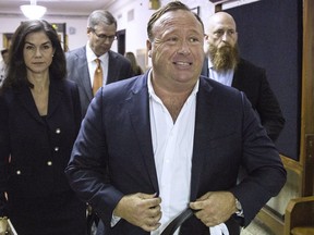In this April 17, 2017, file photo, "Infowars" host Alex Jones arrives at the Travis County Courthouse in Austin, Texas.