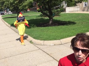 A screengrab of a The Providence Journal's interview with Patricia Morgan, who is running for governor of Rhode Island. One of her campaign volunteers, "Al the Debate Chicken," is seen in the background.
