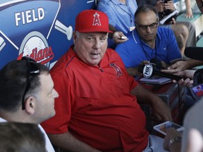 Los Angeles Angels manager Mike Scioscia speaks during a press conference before a baseball game between the Cleveland Indians and the Angels, Sunday, Aug. 5, 2018, in Cleveland.