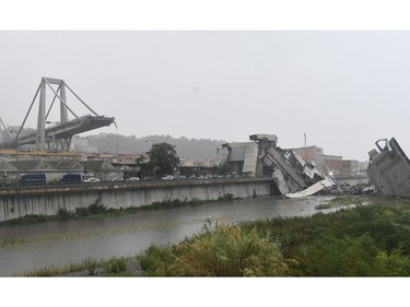 A view of the collapsed Morandi highway bridge in Genoa, northern Italy, Tuesday, Aug. 14, 2018.