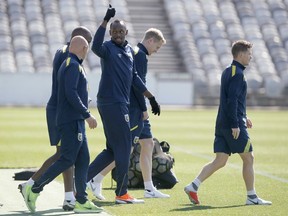 Jamaica's Usain Bolt gestures during training with the Central Coast Mariners soccer team in Newcastle, Australia, Tuesday, Aug. 21, 2018.