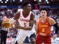 Canada's R.J. Barrett looks to pass as China's Dehao Yu defends during second half Pacific Rim Basketball Classic action in Vancouver on Friday, June 22, 2018.