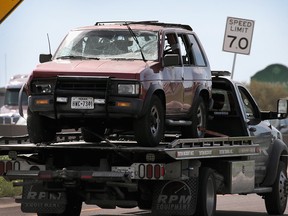 The vehicle that the Austin package bomber, Mark Anthony Conditt, was driving when he blew himself up is towed from the crime scene along Interstate 35 in suburban Austin on March 21, 2018 in Round Rock, Texas. (Scott Olson/Getty Images)