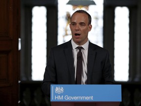 Britain's Secretary of State for Exiting the European Union, Dominic Raab gestures during his speech outlining the government's plans for a no-deal Brexit in London, Thursday, Aug. 23, 2018.