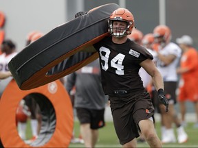 Cleveland Browns defensive end Carl Nassib runs a drill during training camp, in Berea, Ohio, on Thursday, July 26, 2018.