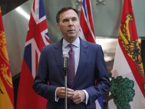 Finance Minister Bill Morneau speaks with reporters before a meeting with provincial and territorial finance ministers in Ottawa on June 26, 2018.