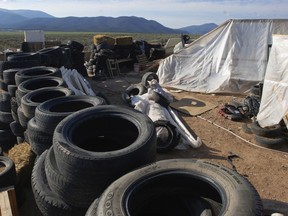 In this Aug. 10, 2018, file photo, is a makeshift living compound in Amalia, N.M.