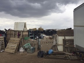 This Friday, Aug. 3, 2018, photo released by Taos County Sheriff's Office shows a rural compound during an unsuccessful search for a missing 3-year-old boy in Amalia, N.M.
