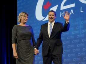 Conservative Leader Andrew Scheer and his wife Jill Scheer arrive on stage at the Conservative national convention in Halifax on Thursday, Aug. 23, 2018.