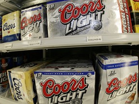 This May 7, 2007 file photo shows boxes of Coors Light and Coors beer in a liquor store in southeast Denver. (AP Photo/David Zalubowski, file)