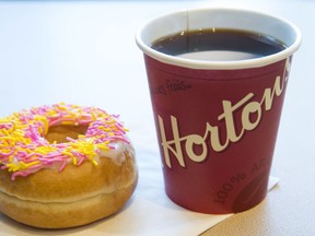 A coffee and donut from Tim Hortons is shown at a Coquitlam B.C., location on Thursday, April 26, 2018.