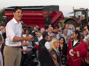 Prime Minister Justin Trudeau addresses local Liberals and Liberal MPs from the South Shore of Montreal for a summer corn roast in Sabrevois, Que., on Thursday, August 16, 2018.