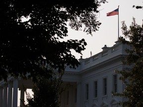 An American flag above the White House flies at full-staff less than 48 hours after the death of Sen. John McCain, Monday, Aug. 27, 2018, in Washington.