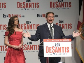 Florida Republican gubernatorial candidate Ron DeSantis, right, speaks to supporters with his wife Casey at an election party after winning the Republican primary Tuesday, Aug. 28, 2018, in Orlando, Fla.