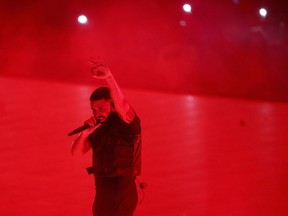 Drake performs during the "Aubrey & The Three Amigos Tour" in Toronto, Tuesday August 21, 2018.