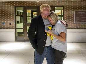 Mark and Jen Dyke react after it appears their son will keep his therapy ducks after a Georgetown Township Zoning Board of Appeals meeting on Wednesday, Aug. 22, 2018. (Cory Morse/The Grand Rapids Press via AP)
