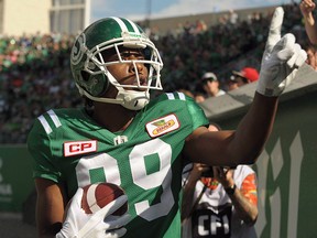 Saskatchewan Roughriders wide receiver Duron Carter celebrates a touchdown by taunting Winnipeg Blue Bombers fans September 3, 2017. (THE CANADIAN PRESS/Mark Taylor)