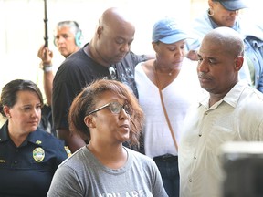 Family and relatives of Elijah Clayton address the media after he was killed during a shooting at GLHF Game Bar at the Jacksonville Landing on Aug. 27, 2018 in Jacksonville, Fla.