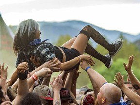 In this Oct. 25, 2015 file photo, a festival-goer crowd surfs at the 2015 Knotfest USA in San Bernardino, Calif.