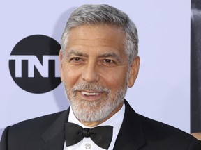 FILE - In this June 7, 2018, file photo, George Clooney arrives at the 46th AFI Life Achievement Award Honoring himself at the Dolby Theatre in Los Angeles. Clooney tops the 2018 Forbes' list of highest-paid actors with $239 million in pretax earnings. Forbes credits up to $1 billion that a British conglomerate said it would pay for Casamigos Tequila, which Clooney co-founded in 2013 with two entrepreneurs.