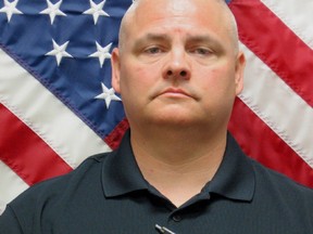 Former police officer David Rose poses for a photo in Henry County Ga. (Henry County Police Department via AP)