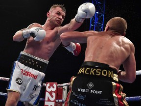 Carl Frampton throws a left at Luke Jackson during their fight for the WBO interim featherweight title at Windsor Park on August 18, 2018 in Belfast. (Charles McQuillan/Getty Images)