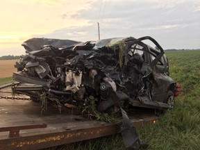 Police say two people were sent to hospital after a serious collision between a garbage truck and a car, shown, in southwestern Ontario near London.