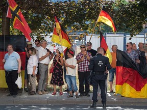 This picture taken on August 16, 2018 in Dresden, Germany, shows anti-Islam Pegida movement supporters demonstrating on the occasion of German Chancellor's visit at the Saxon state parliament. (SEBASTIAN KAHNERT/AFP/Getty Images)