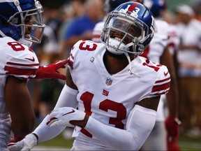 Odell Beckham warms up with Sterling Shepard of before the New York Giants preseason game against the New York Jets at MetLife Stadium on August 24, 2018 in East Rutherford, New Jersey.