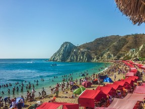 Sunny day at crowded island beach at El Rodadero in Santa Marta, one of the most famous and visited watering places of Colombia. (Getty Images)