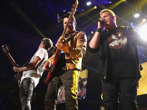 Singer Gary LeVox (R), Joe Don Rooney (L) and Jay DeMarcus (C) of Rascal Flatts perform onstage during the 2017 iHeartCountry Festival, A Music Experience by AT&T at The Frank Erwin Center on May 6, 2017 in Austin, Texas.  (Christopher Polk/Getty Images for iHeartMedia)