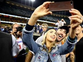 Justin Verlander of the Houston Astros takes a picture with Kate Upton after the Astros defeated the Los Angeles Dodgers 5-1 in game seven to win the 2017 World Series at Dodger Stadium on November 1, 2017 in Los Angeles, Calif.  (Ezra Shaw/Getty Images)