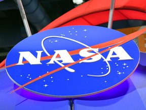 The NASA logo is displayed at the agency's booth during CES 2018 at the Las Vegas Convention Center on January 11, 2018 in Las Vegas, Nevada.
