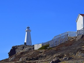 A view of the rugged cliffs towards the historic 19th century lighthouse at Cape Spear National Historic site in Newfoundland. (iStock/Getty Images Plus)