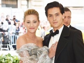 Lili Reinhart and Cole Sprouse attend the Heavenly Bodies: Fashion & The Catholic Imagination Costume Institute Gala at The Metropolitan Museum of Art on May 7, 2018 in New York City.  (Jamie McCarthy/Getty Images)